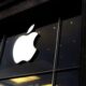 Apple logo displayed outside an Apple Store after the company announced a price hike for MacBooks and iPads in India.