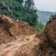 Mud and large boulders block a road after the Wayanad landslide near Kalladi in Meppadi