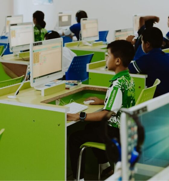 Students use desktop computers during a computer in a school laboratory.