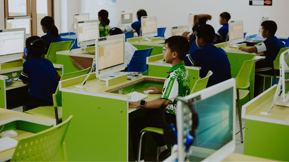Students use desktop computers during a computer in a school laboratory.