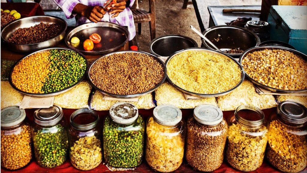 India Beat Hunger. Now It Has to Make Healthy Food Affordable 42 An Indian street food stall displaying pulses, sprouts, legumes and other nutritious foods, highlighting the importance of diverse diets for food security and nutrition.