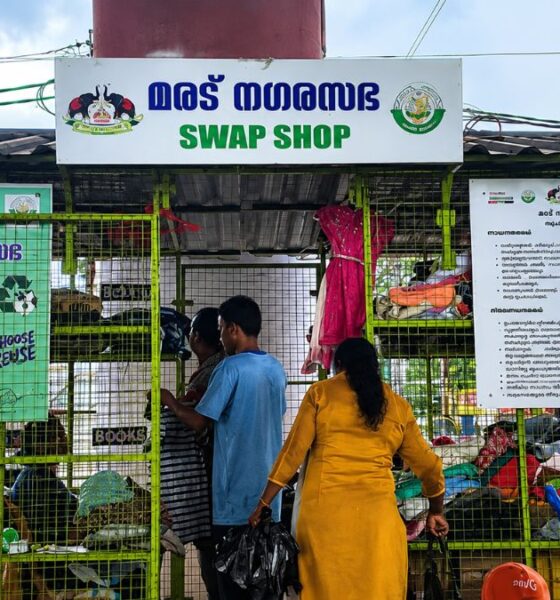People browse donated clothes and household items at the Maradu Nagarasabha Swap Shop, a community reuse centre promoting recycling and sustainable consumption in Kerala.