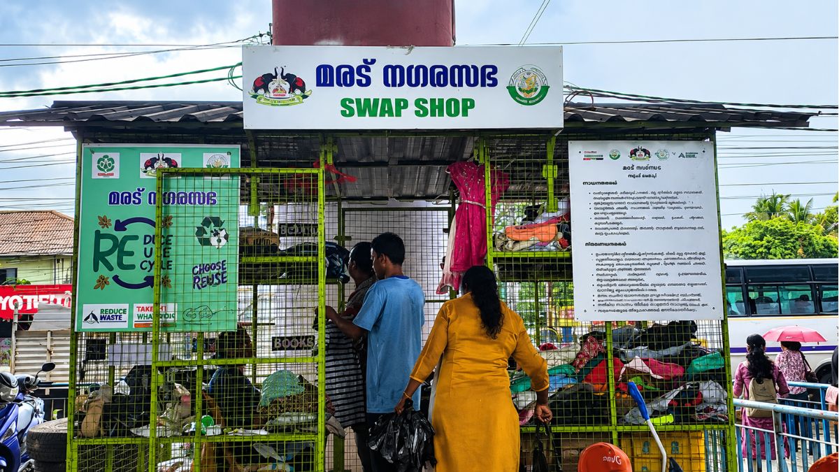 People browse donated clothes and household items at the Maradu Nagarasabha Swap Shop, a community reuse centre promoting recycling and sustainable consumption in Kerala.