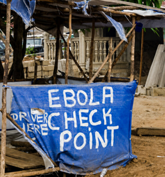 An Ebola screening checkpoint at a roadside in an African community during an Ebola outbreak.