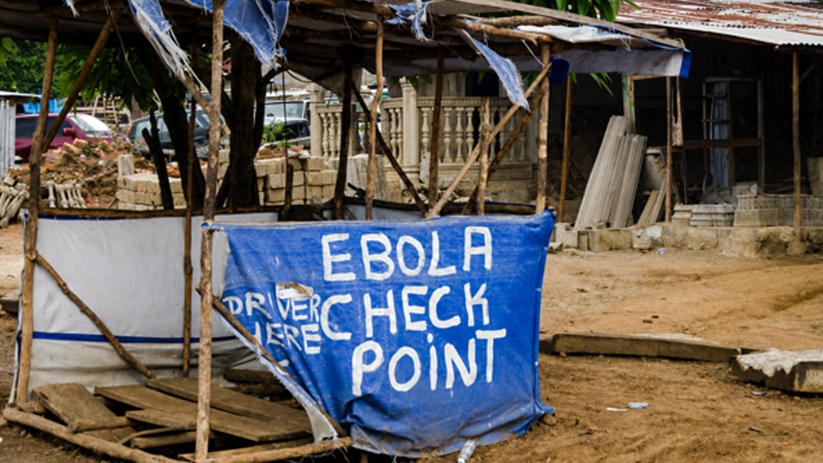 An Ebola screening checkpoint at a roadside in an African community during an Ebola outbreak.