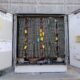 Open battery storage enclosure containing hundreds of connected battery cells and electrical wiring that may help store solar energy.