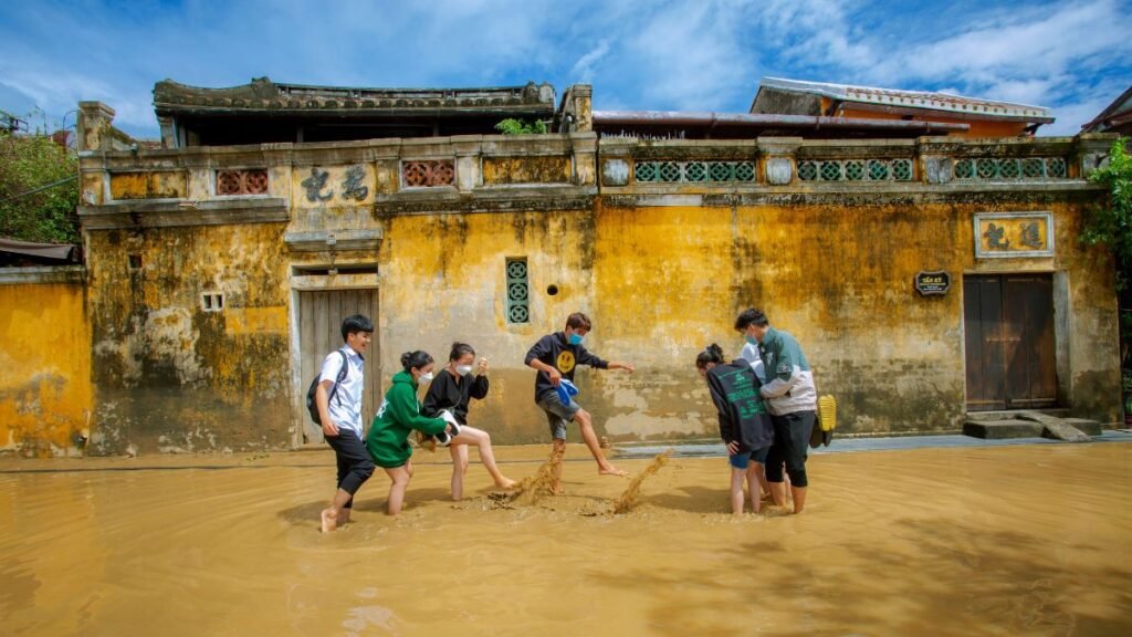 Kerala Floods Highlight a Recurring Health Crisis as Disease Risks Rise 42 People wade through floodwater, highlighting exposure to contaminated water that can transmit leptospirosis.