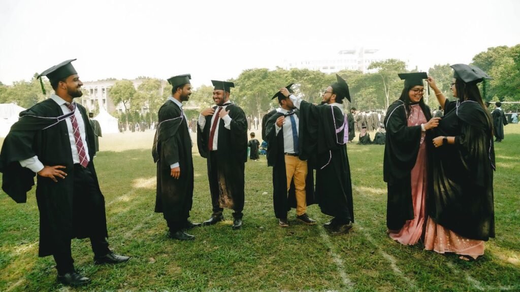 Top States With Fake Universities in India: Delhi Tops UGC List, Students Urged to Verify Institutions 42 Graduates in academic gowns celebrate during a university convocation ceremony, highlighting the importance of earning degrees from UGC-recognised institutions.