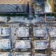 Aerial view of an industrial facility with piles of processed waste, highlighting waste management and CBG production.