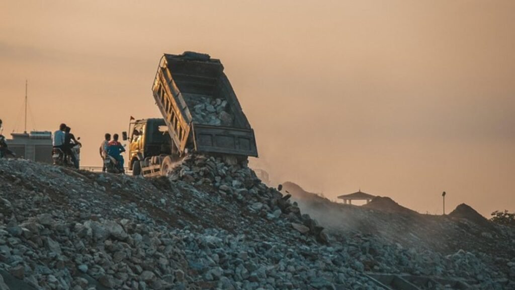 Can India Finally Turn Waste Into Fuel? INR 23,731-Crore CBG Push 42 Dump truck unloading waste at a landfill, highlighting the organic waste management challenge behind India’s push to expand compressed biogas production.