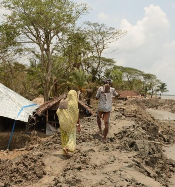 Riverbank erosion threatening homes and livelihoods along a flood-prone riverbank.