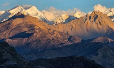 Snow-covered Himalayas and rugged slopes, illustrating the region’s growing vulnerability to climate and geological hazards.