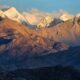 Snow-covered Himalayas and rugged slopes, illustrating the region’s growing vulnerability to climate and geological hazards.