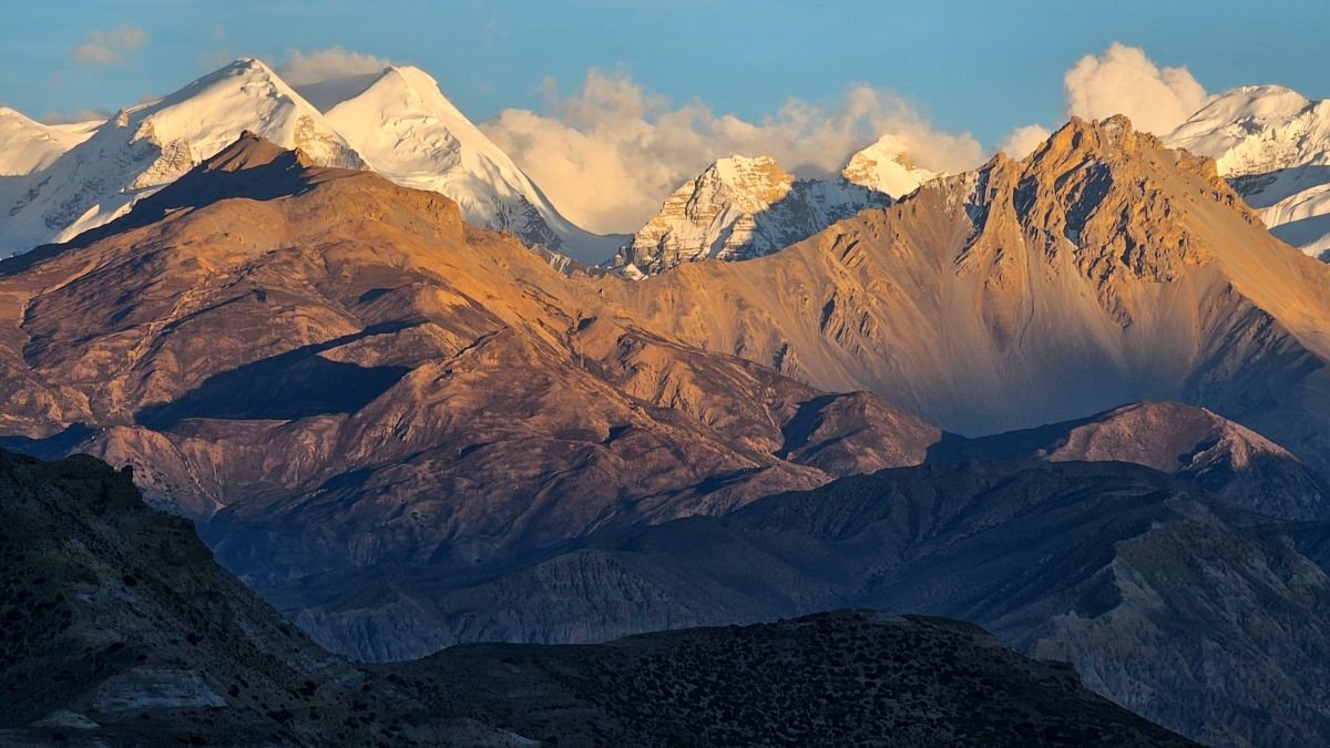 Snow-covered Himalayas and rugged slopes, illustrating the region’s growing vulnerability to climate and geological hazards.