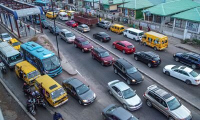 Busy Indian city road with cars and commercial vehicles, illustrating India’s changing passenger-vehicle market