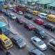 Busy Indian city road with cars and commercial vehicles, illustrating India’s changing passenger-vehicle market