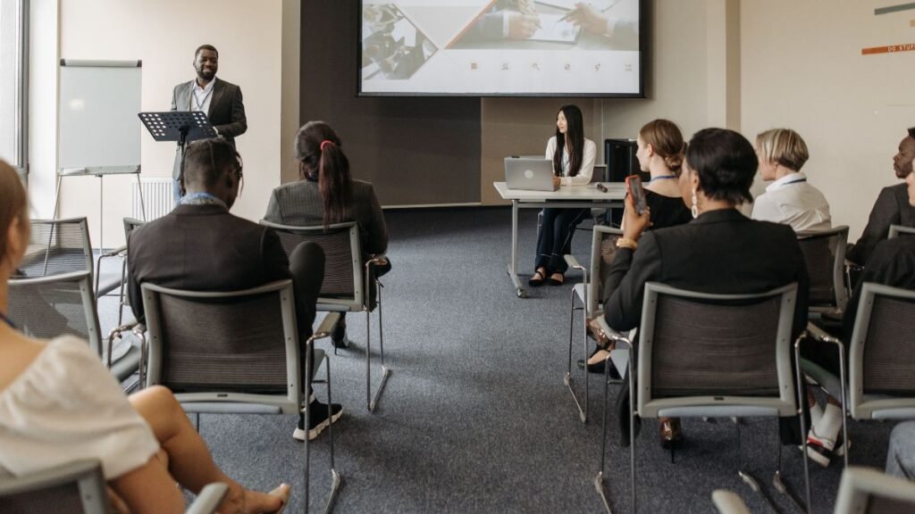 Professionals attend a business analysis training session for worldskills, highlighting the importance of upskilling for a changing job market.