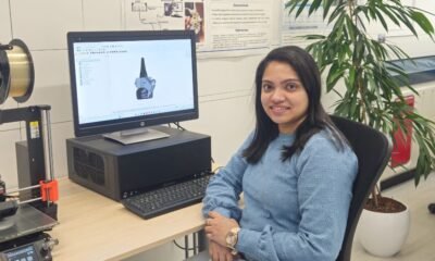 Photoacoustic imaging researcher Anjali Thomas working with medical imaging equipment in a laboratory