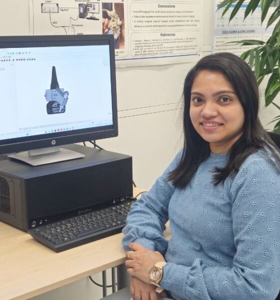 Photoacoustic imaging researcher Anjali Thomas working with medical imaging equipment in a laboratory