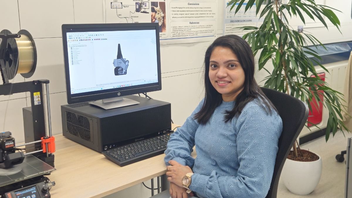 Photoacoustic imaging researcher Anjali Thomas working with medical imaging equipment in a laboratory
