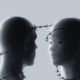 Conceptual image of two humanoid figures facing each other with barbed wire around their heads and necks, representing AI risks and safety constraints.