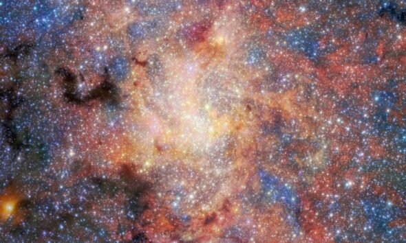 JWST infrared view of the densely populated region around the Milky Way’s central black hole, filled with stars, glowing gas and dust.