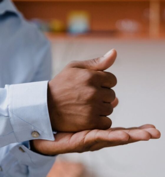 Hands demonstrating Indian Sign Language, highlighting visual communication for deaf people.