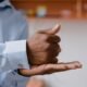 Hands demonstrating Indian Sign Language, highlighting visual communication for deaf people.