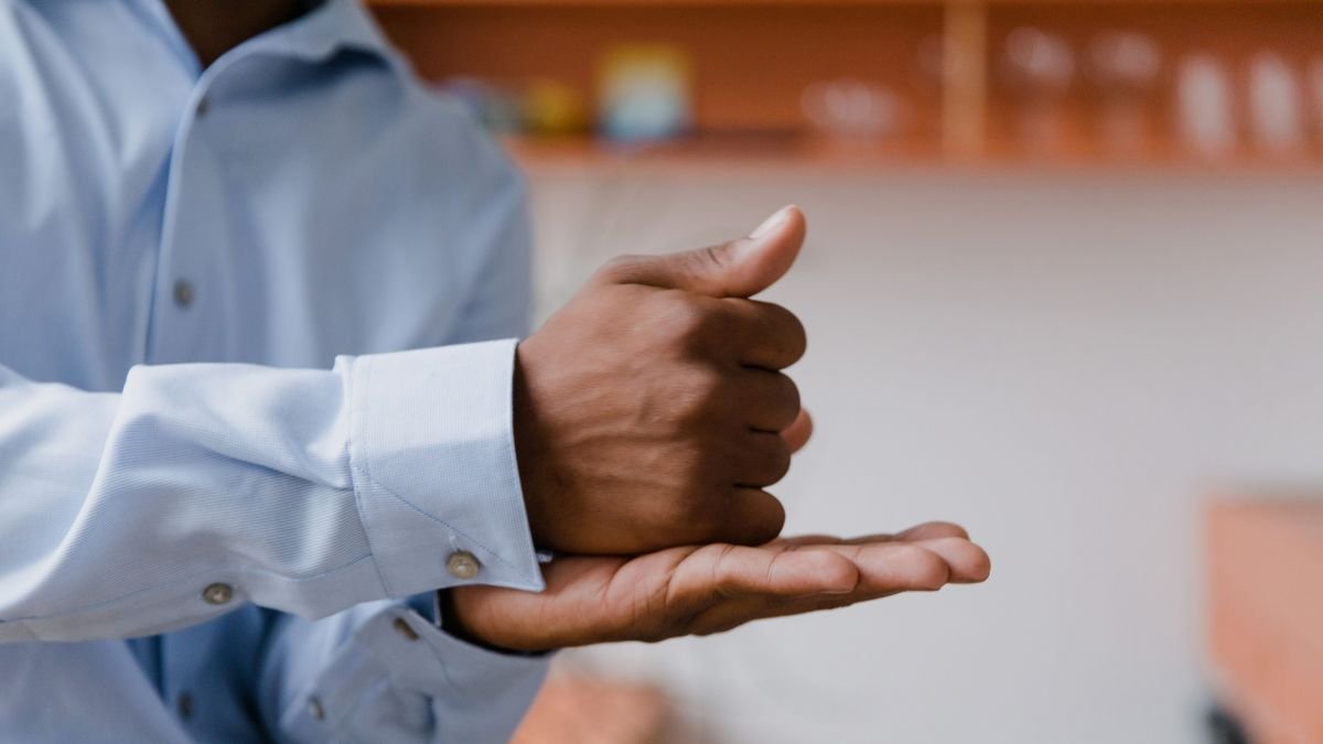 Hands demonstrating Indian Sign Language, highlighting visual communication for deaf people.
