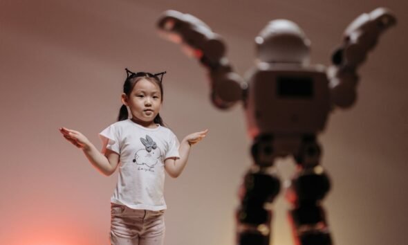 Girl standing beside a humanoid robot, illustrating the gender gap in artificial intelligence and who shapes the technology