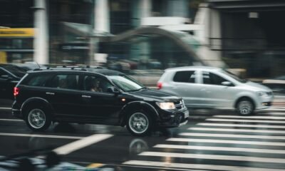 Passenger cars driving through a busy city intersection, illustrating India’s growing road transport and fuel demand