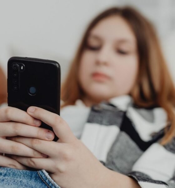 Teenager using a smartphone as Greece moves to ban social media access for children under 15.