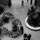 Folded aluminium geometric structure displayed in a public library atrium, demonstrating an origami-inspired architectural design.