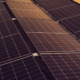 Close-up view of photovoltaic solar panels arranged in rows, illustrating solar energy generation and renewable energy technology.